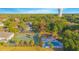 Aerial view of community features including tennis courts and swimming pool at 620 Cranes Way # 207, Altamonte Springs, FL 32701