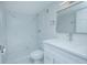 Modern bathroom with a marble shower and white vanity at 620 Cranes Way # 207, Altamonte Springs, FL 32701