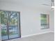 Bedroom with sliding glass door to balcony and large windows at 620 Cranes Way # 207, Altamonte Springs, FL 32701