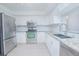 Updated kitchen with stainless steel appliances and granite countertops at 620 Cranes Way # 207, Altamonte Springs, FL 32701