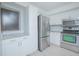 Updated kitchen with stainless steel appliances and white cabinets at 620 Cranes Way # 207, Altamonte Springs, FL 32701