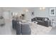 Bright living room with hardwood floors, stylish furniture, and access to dining area at 620 Cranes Way # 207, Altamonte Springs, FL 32701