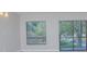 Living room featuring a sliding glass door and large window at 620 Cranes Way # 207, Altamonte Springs, FL 32701