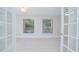 Spacious living area with hardwood floors and French doors at 620 Cranes Way # 207, Altamonte Springs, FL 32701