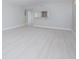 Spacious living room with light gray walls and wood-look flooring at 620 Cranes Way # 207, Altamonte Springs, FL 32701