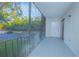 Private screened balcony overlooking trees and parking at 620 Cranes Way # 207, Altamonte Springs, FL 32701