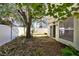 Private backyard with patio and mature tree at 9517 Brackin St, Orlando, FL 32825