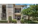 Inviting condo building exterior with lush landscaping and a private entrance at 1055 Kensington Park Dr # 502, Altamonte Springs, FL 32714