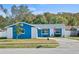 Charming blue house with a well-maintained lawn and driveway at 1345 Nolton Way, Orlando, FL 32822