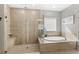 Modern bathroom with a large walk-in shower and a built-in bench at 1668 Marsh Pointe Dr, Clermont, FL 34711