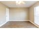 Bright bedroom with wood-look floors and window at 224 Jalapa Dr, Kissimmee, FL 34743