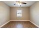 Bedroom with wood-look floors and ceiling fan at 224 Jalapa Dr, Kissimmee, FL 34743