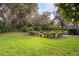 Expansive backyard with lush landscaping and trees at 3277 Lakeview Oaks Dr, Longwood, FL 32779