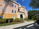 Condo building with columns and a manicured lawn at 3577 Conroy Rd # 334, Orlando, FL 32839