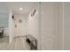 Bright condo entryway with bench and storage at 4 Oceans West Blvd # 102C, Daytona Beach Shores, FL 32118