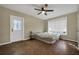 Bedroom with hardwood floors and a window with blinds at 411 Sylvan Dr, Winter Park, FL 32789