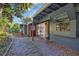 Brick walkway leads to home's side entrance at 411 Sylvan Dr, Winter Park, FL 32789