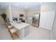 Modern kitchen featuring stainless steel appliances, granite countertops, and white cabinets at 4404 Bedford Way, Leesburg, FL 34748