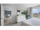 Bedroom with white dresser, sitting area, and view into dining area at 443 Taylor Groves Dr, Lake Wales, FL 33853