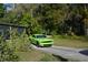 Mobile home with green car parked in front at 4750 N Ronald Reagan Blvd, Sanford, FL 32771