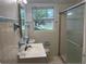 Clean bathroom with updated vanity and shower at 5512 S Tampa Ave, Orlando, FL 32839