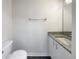 Simple bathroom with granite countertop and single sink vanity at 7 Bolton Ct, Kissimmee, FL 34758