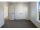 Spacious bedroom with two closets and neutral carpeting at 7 Bolton Ct, Kissimmee, FL 34758