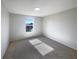 Spacious bedroom with carpeted floors and a large window at 7 Bolton Ct, Kissimmee, FL 34758