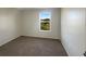 Bright bedroom with carpeted floor and a window at 7 Bolton Ct, Kissimmee, FL 34758