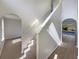 Bright entryway with staircase, hardwood floors, and views into adjacent living areas at 7 Bolton Ct, Kissimmee, FL 34758