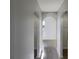 Bright hallway with arched entryways and closets at 7 Bolton Ct, Kissimmee, FL 34758