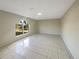 Spacious living room with large window and tile floors at 7 Bolton Ct, Kissimmee, FL 34758