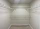 Spacious walk-in closet with wire shelving at 7 Bolton Ct, Kissimmee, FL 34758