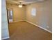 Main bedroom with carpet, window, and ceiling fan at 7001 Hershey Way, Orlando, FL 32822