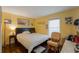 Bright bedroom with a queen-size bed and relaxing sitting area at 7022 Talbot Dr, Orlando, FL 32819