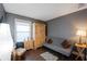 Cozy home office features a comfortable sofa, wooden armoire, and ample natural light at 7022 Talbot Dr, Orlando, FL 32819