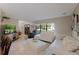 Bright living room featuring white couches and a large TV at 7022 Talbot Dr, Orlando, FL 32819