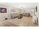 Spacious living room with tiled floors and sofas at 800 Daybreak Dr, Fruitland Park, FL 34731