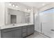 Main bathroom with double vanity and walk-in shower at 8013 Basilica Ln, Winter Garden, FL 34787