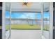 Spacious backyard with a tranquil waterfront view, perfect for relaxation and outdoor activities at 840 Livestock Loop, Saint Cloud, FL 34771