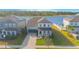 Charming two-story home with solar panels, a landscaped yard, and a waterfront view at 840 Livestock Loop, St Cloud, FL 34771