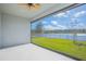 Screened patio overlooking a serene pond at 840 Livestock Loop, St Cloud, FL 34771