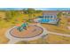 Community playground with slides, climbing structures, benches, and a grassy area at 840 Livestock Loop, St Cloud, FL 34771