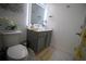 Clean bathroom with gray vanity, toilet and marble flooring at 881 Orchid Grove Blvd, Davenport, FL 33837
