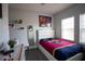 Bright bedroom with large windows and FC Barcelona bedding at 881 Orchid Grove Blvd, Davenport, FL 33837