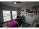 Cozy bedroom featuring a desk and FC Barcelona bedding at 881 Orchid Grove Blvd, Davenport, FL 33837