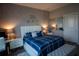 Elegant bedroom with a king-size bed and stylish decor at 881 Orchid Grove Blvd, Davenport, FL 33837