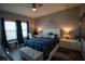 Spacious bedroom with a king-size bed, and a large window at 881 Orchid Grove Blvd, Davenport, FL 33837