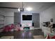 Finished garage with large TV, fireplace, and play area at 881 Orchid Grove Blvd, Davenport, FL 33837