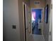 Hallway with doors leading to bedrooms and other areas at 881 Orchid Grove Blvd, Davenport, FL 33837